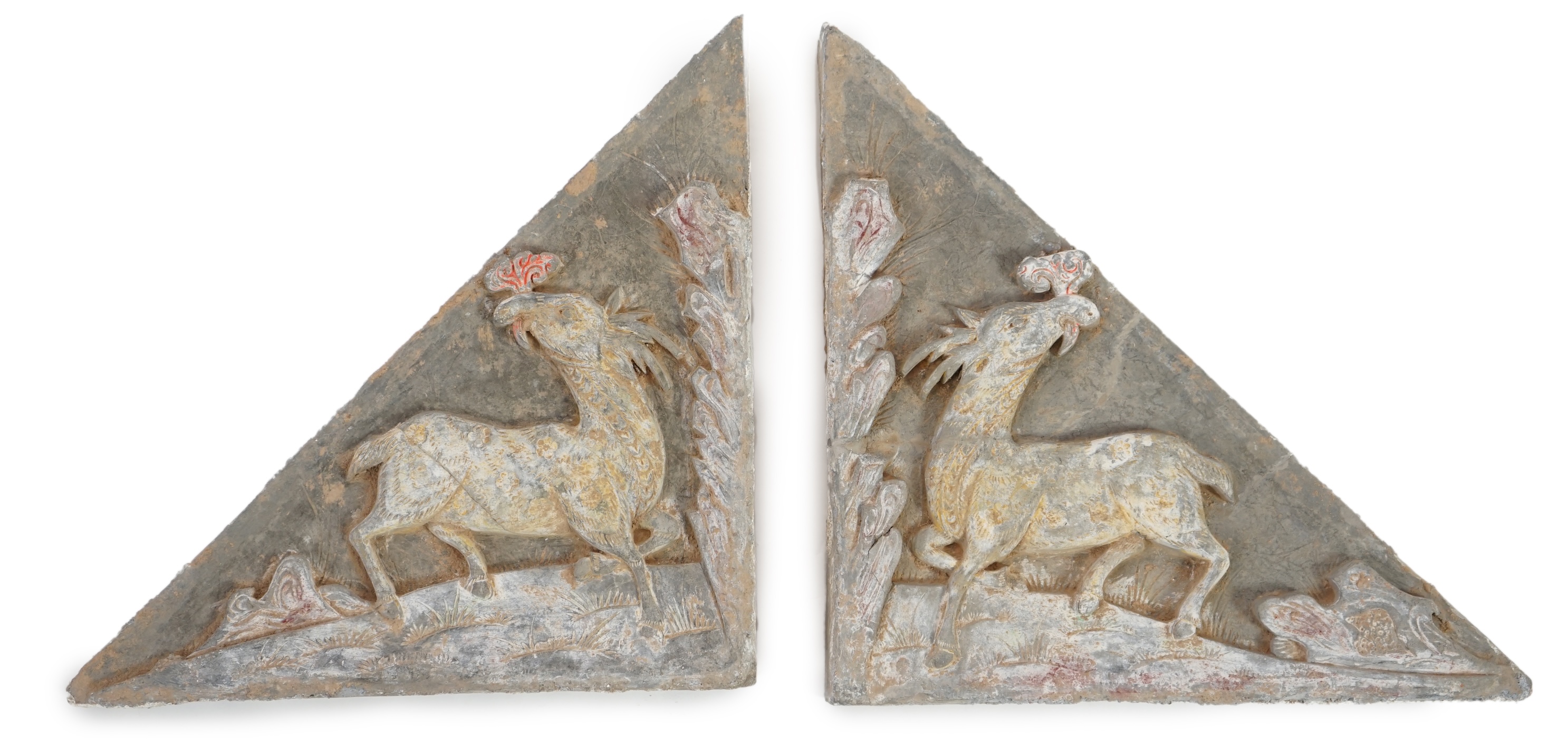 A fine pair of large Chinese painted pottery triangular tiles, Ming Dynasty (1368-1644)